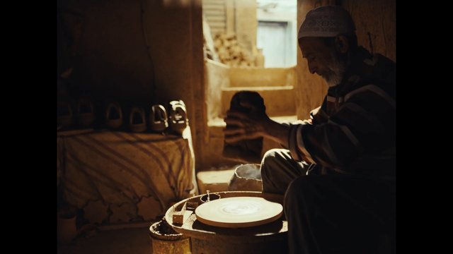 Video Reference: pottery, ceramics, artisan, craft, workshop, elderly man, handmade, tradition, sunlight, indoors, wheel, clay, small business, cultural, skill, handwork