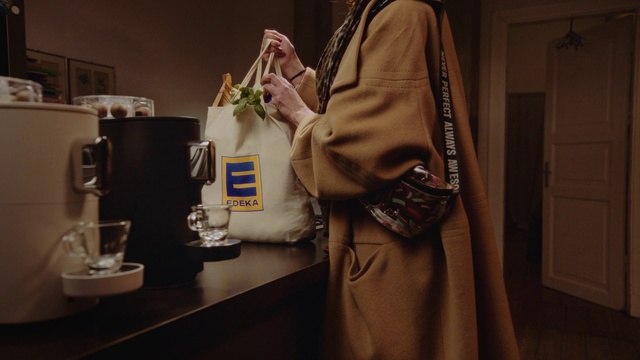 Video Reference: Outerwear, Sleeve, Luggage and bags, Fashion design, Blazer, Eyewear, Bag, Shoulder bag, Tableware, Formal wear