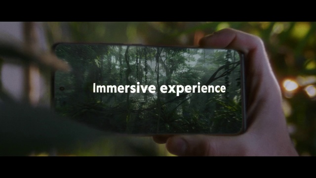 Video Reference: World, Gesture, Gadget, Finger, Font, Grass, Rectangle, Electronic device, Display device, Thumb