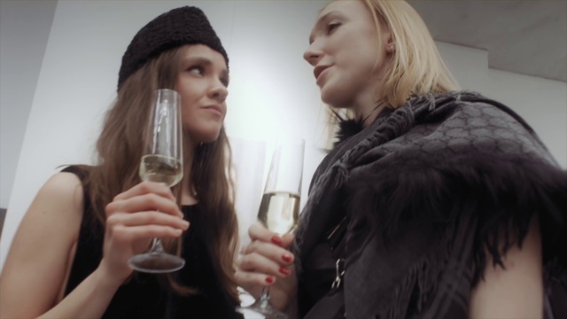 Video Reference: Lip, Eyelash, Tableware, Wine glass, Gesture, Cap, Flash photography, Fashion design, Layered hair, Fun