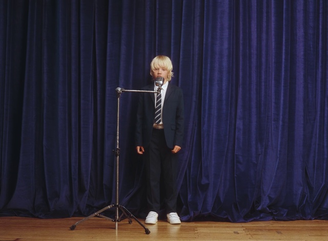 Video Reference: Theater curtain, Curtain, Coat, Suit, Entertainment, Performing arts, Tie, Music, Event, Formal wear