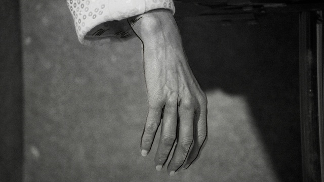 Video Reference: Skin, Hand, Arm, Human body, Neck, Flash photography, Gesture, Nail, Grey, Style