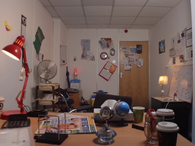 Video Reference: Table, Property, Building, Desk, Interior design, Computer desk, House, Picture frame, Living room, Lamp