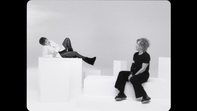Video Reference: Comfort, Gesture, Black-and-white, Flash photography, Automotive design, Font, Art, White-collar worker, Event, Monochrome photography