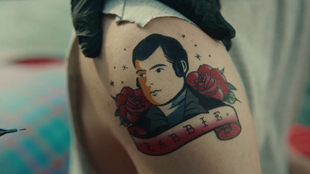 Video Reference: Joint, Shoulder, Tattoo artist, Mouth, Human body, Neck, Sleeve, Eyelash, Temporary tattoo, Thigh