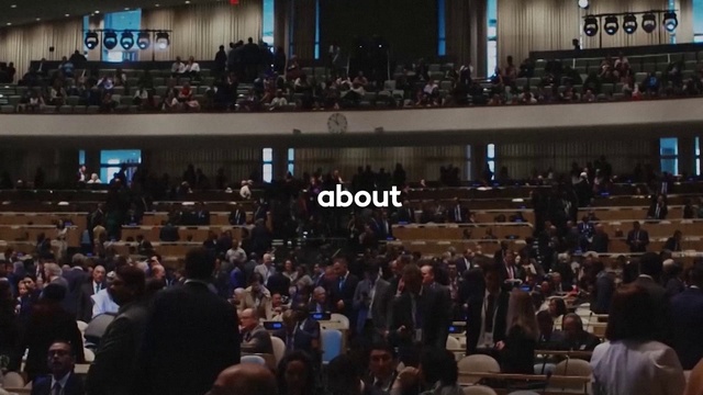 Video Reference: Crowd, Musical instrument accessory, Event, Suit, Chair, City, Stage, Audience, Entertainment, Public event