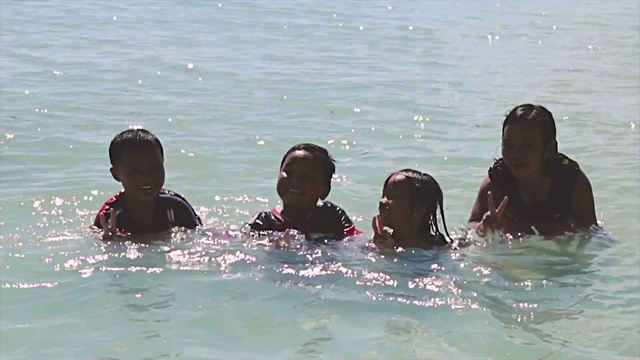 Video Reference: Water, Facial expression, Happy, Fluid, Liquid, Organism, Outdoor recreation, Lake, Leisure, Recreation