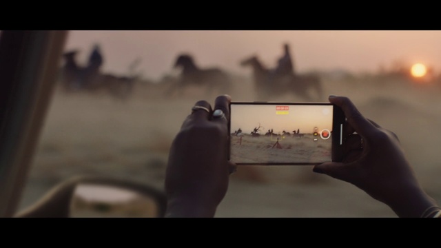 Video Reference: Flash photography, Gesture, Sky, Communication Device, Eyewear, Gadget, Morning, Travel, Tints and shades, Tablet computer