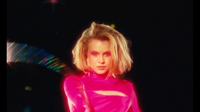 Video Reference: Lip, Hairstyle, Eye, Flash photography, Eyelash, Entertainment, Fun, Magenta, Event, Electric blue