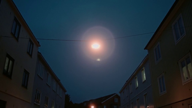 Video Reference: Building, Sky, Atmosphere, Window, Electricity, Atmospheric phenomenon, Astronomical object, Moon, Tints and shades, Midnight