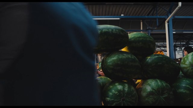 Video Reference: watermelon, fruit, market, warehouse, produce, stacked, indoor, food, fresh, green, large, vendor, shopping, agriculture