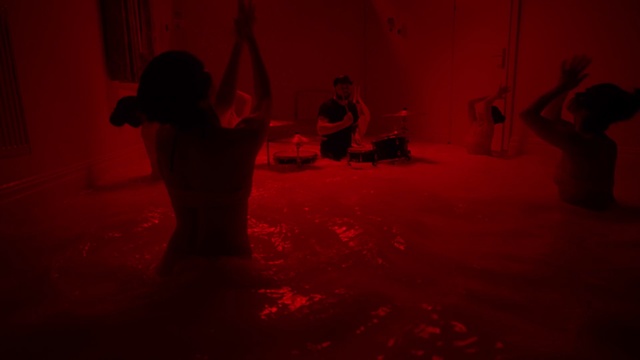 Video Reference: Flash photography, Performing arts, Entertainment, Flooring, Magenta, Tints and shades, Chair, Elbow, Event, Fun