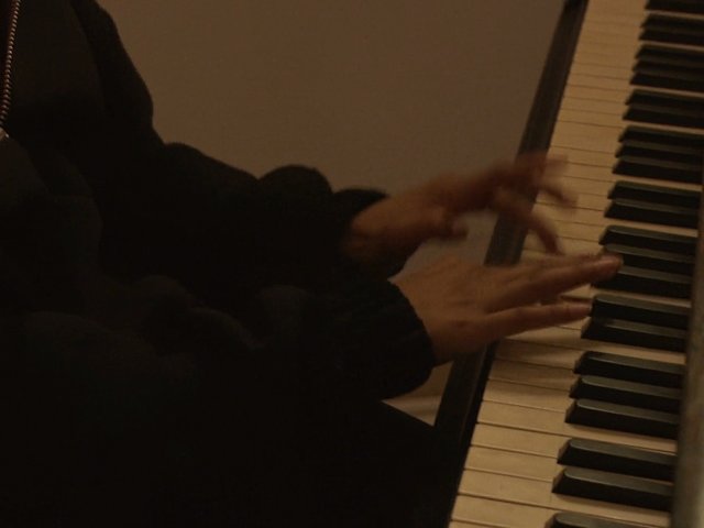 Video Reference: piano, keyboard, hands, music, pianist, playing, instrument, performance, close-up, indoor, warm light, practice
