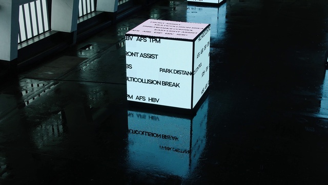 Video Reference: Rectangle, Font, Gas, Road surface, Tints and shades, Flooring, Signage, Electric blue, Advertising, Darkness