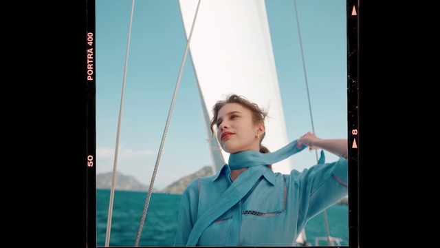 Video Reference: Sky, Standing, Flash photography, Gesture, Electric blue, Sailing, Public utility, Portrait photography, Glass