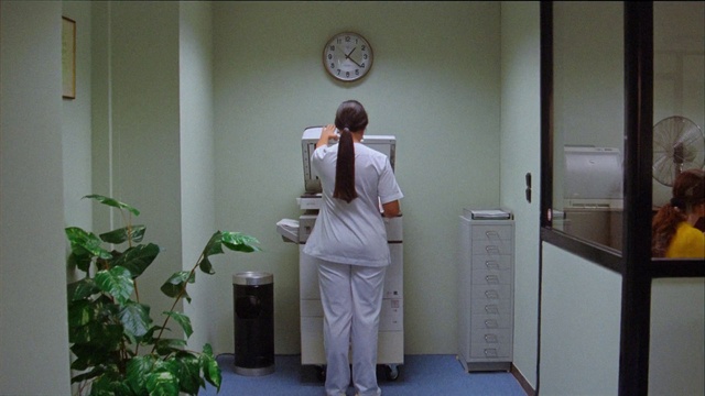 Video Reference: Plant, Sleeve, Standing, White coat, Health care provider, Building, Clock, Health care, Door, Clinic