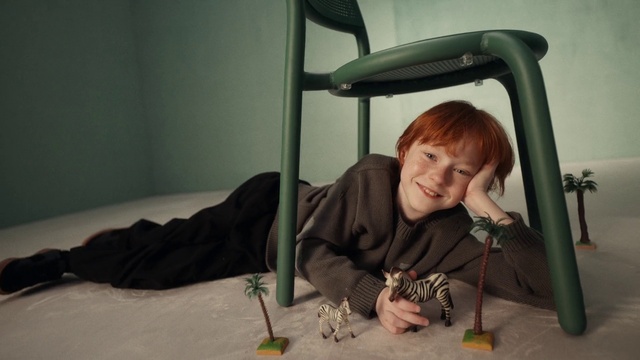 Video Reference: Smile, Comfort, Toy, Wood, Vehicle door, T-shirt, Flooring, Chair, Windshield, Fun