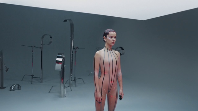 Video Reference: Shoulder, Sleeve, Standing, Art, Grey, Waist, Fashion design, Human anatomy, Microphone, Chest