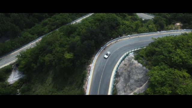 Video Reference: Car, Road surface, Vehicle, Tree, Plant, Asphalt, Motor vehicle, Natural landscape, Thoroughfare, Landscape