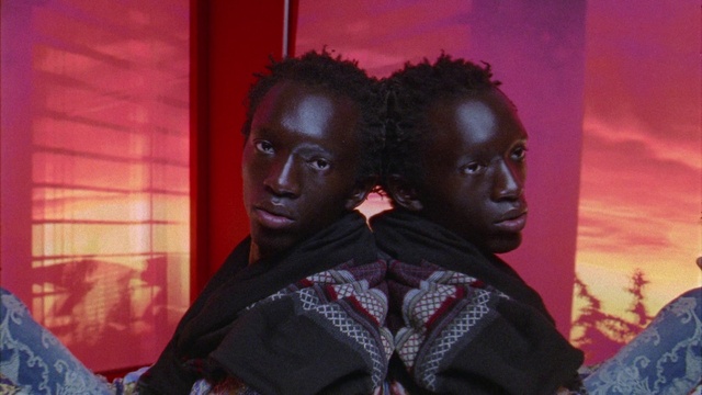 Video Reference: Outerwear, Jheri curl, Purple, Black hair, Adaptation, Fashion design, Cornrows, Fun, Earrings, Magenta