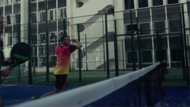 Video Reference: Building, Window, Shorts, Racquet sport, Tree, House, Leisure, Facade, City, Net