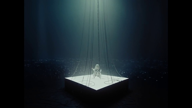 Video Reference: Font, Art, Event, Entertainment, Rectangle, Symmetry, Electric blue, Glass, Automotive design, Darkness