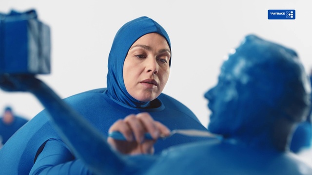 Video Reference: Blue, Mouth, Azure, Sleeve, Gesture, Headgear, Happy, Electric blue, Landscape, Comfort