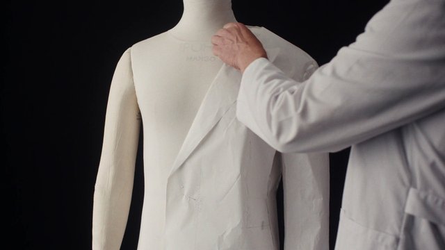 Video Reference: dress form, tailoring, pattern making, fashion design, sewing, garment prototype, mannequin, studio, white coat, textile, design process, workshop, clothing, hand work