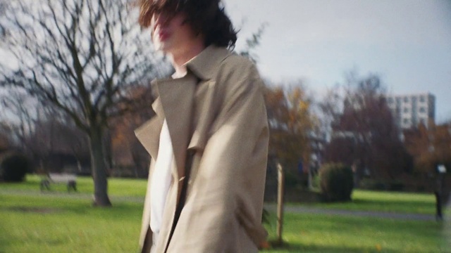 Video Reference: Plant, Sky, Dress shirt, Sleeve, Vision care, Tree, Eyewear, Street fashion, Grass, Blazer