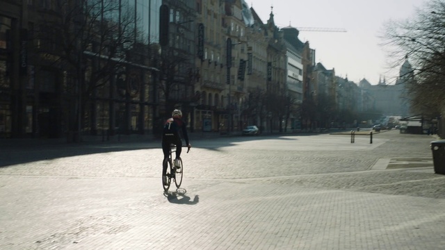 Video Reference: Wheel, Tire, Building, Window, Sky, Road surface, Asphalt, Tree, Automotive tire, Rolling