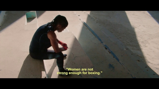 Video Reference: Flash photography, Flooring, Floor, Font, Elbow, T-shirt, Concrete, Asphalt, Knee, Sitting