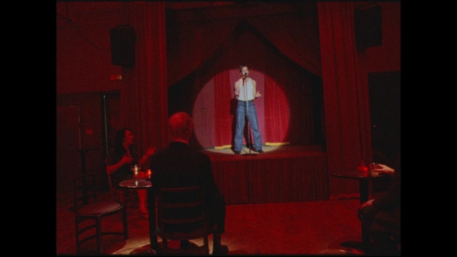 Video Reference: Theater curtain, Performing arts, Curtain, Entertainment, Chair, Performance art, Music venue, Magenta, Event, Suit