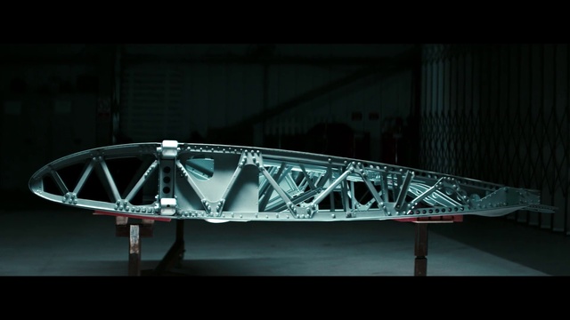 Video Reference: Triangle, Rectangle, Truss bridge, Font, Tints and shades, Automotive design, Symmetry, Entertainment, Art, Visual effect lighting