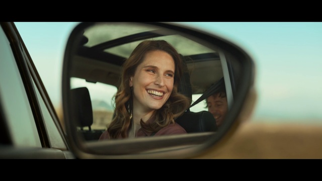 Video Reference: Smile, Lip, Eyebrow, Motor vehicle, Automotive mirror, Automotive design, Flash photography, Rear-view mirror, Automotive exterior, Happy