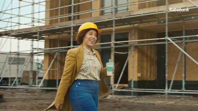 Video Reference: Hard hat, Smile, Helmet, Sleeve, Wood, Headgear, Workwear, Waist, Engineering, Engineer