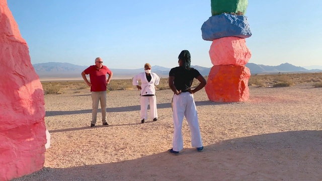 Video Reference: Sky, Azure, Gesture, Travel, Body of water, Red, Leisure, Landscape, Fun, Horizon