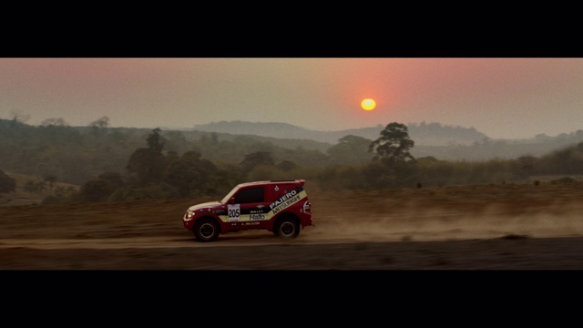 Video Reference: Sky, Vehicle, Tire, Car, Wheel, Automotive tire, Mountain, Off-road racing, Tree, Automotive design