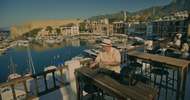 Video Reference: Water, Sky, Furniture, Table, Building, Body of water, Travel, Outdoor furniture, Lake, Morning