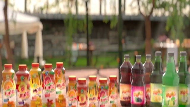 Video Reference: Bottle, Liquid, Drinkware, Glass bottle, Drink, Bottle cap, Alcoholic beverage, Tree, Plant, Plastic bottle