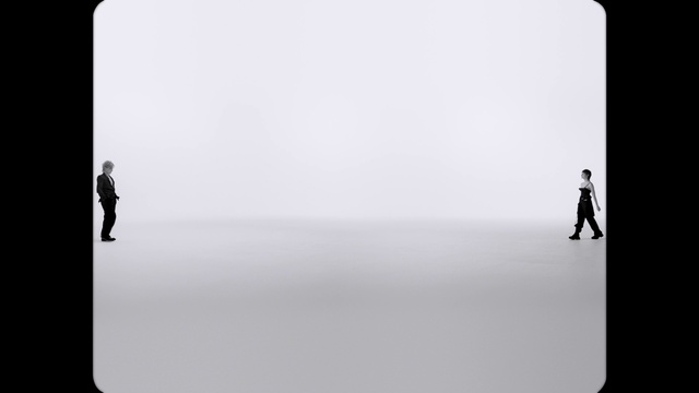 Video Reference: Product, Rectangle, Standing, Gesture, Grey, Font, Black-and-white, Sleeve, Electronic device, Monochrome photography