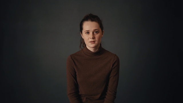 Video Reference: Face, Cheek, Chin, Flash photography, Sleeve, Grey, Blazer, Darkness, Event, Electric blue